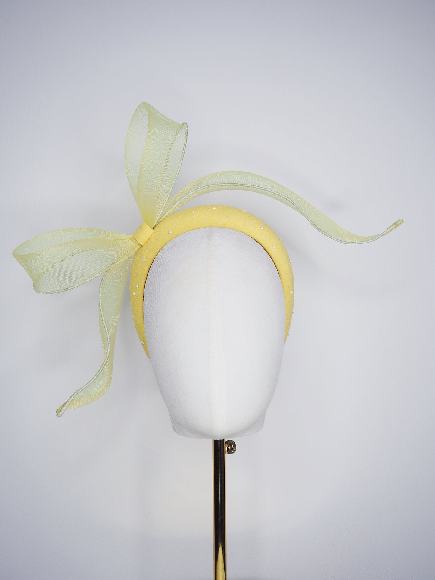 Soleil - A joyful lemon bow headpiece with pearl encrusted veil detail