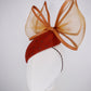 Coco Delight - Brown fur felt face hugger with dramatic crinoline bow and crystal veil detail.