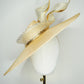 Gilded horizon  - Natural Straw broad brimmed slanted crown parissisal with white and gold lurex leather edged swirl crinoline detail.