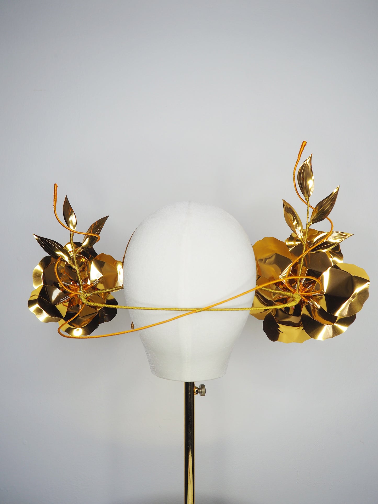 Sunlit Bloom - A wraparound floral headpiece featuring oversized golden blooms with vibrant orange centres.