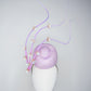 Blossoms in Flight - 	Pastel lilac pork pie pillbox with floating quills and iridescent cherry blossom detail