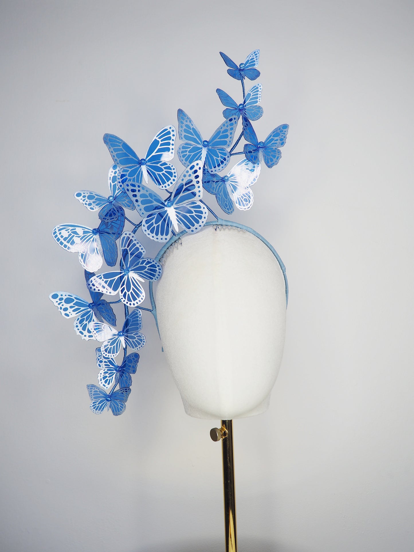Dancing Wings - A graceful cascade of blue butterflies that appear to float effortlessly around the face.