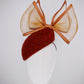 Coco Delight - Brown fur felt face hugger with dramatic crinoline bow and crystal veil detail.