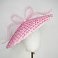Pink Ribbon -Candy pink coolie brim crowned with a sculptural floating crinoline bow.