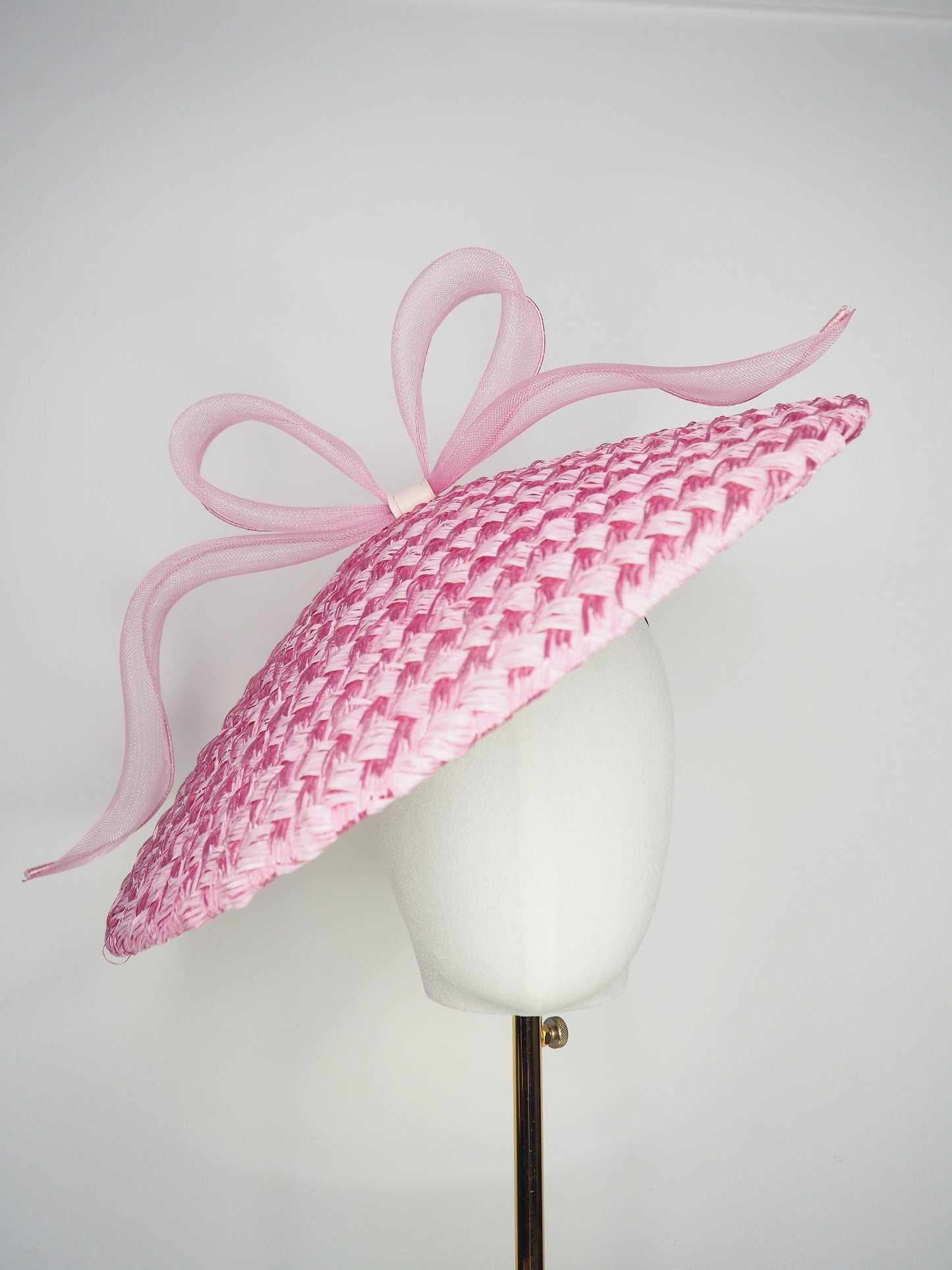Pink Ribbon -Candy pink coolie brim crowned with a sculptural floating crinoline bow.