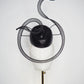 Black Swan - A sleek black lurex pillbox inspired by the graceful silhouette of a swan gliding across water.