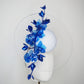 Dancing Orchids - Blue crystoform orchids on a white leather veiles percher base with veil detail