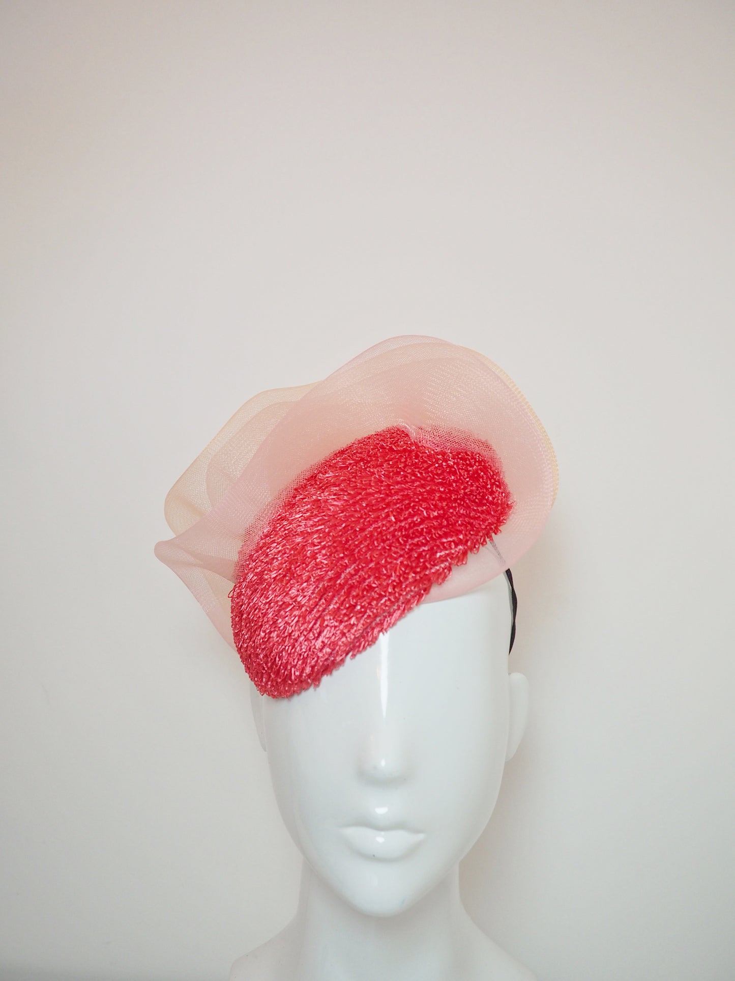 Pink Coral - Vintage raffia watermelon pink straw with pink and peach ruffle crinoline detail on a face hugger base.