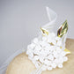 Natural Elegance - Natural knotted straw sloped brim with white hydrangea and gold lurex crinoline straw swirl