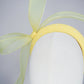 Soleil - A joyful lemon bow headpiece with pearl encrusted veil detail