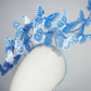 Dancing Wings - A graceful cascade of blue butterflies that appear to float effortlessly around the face.