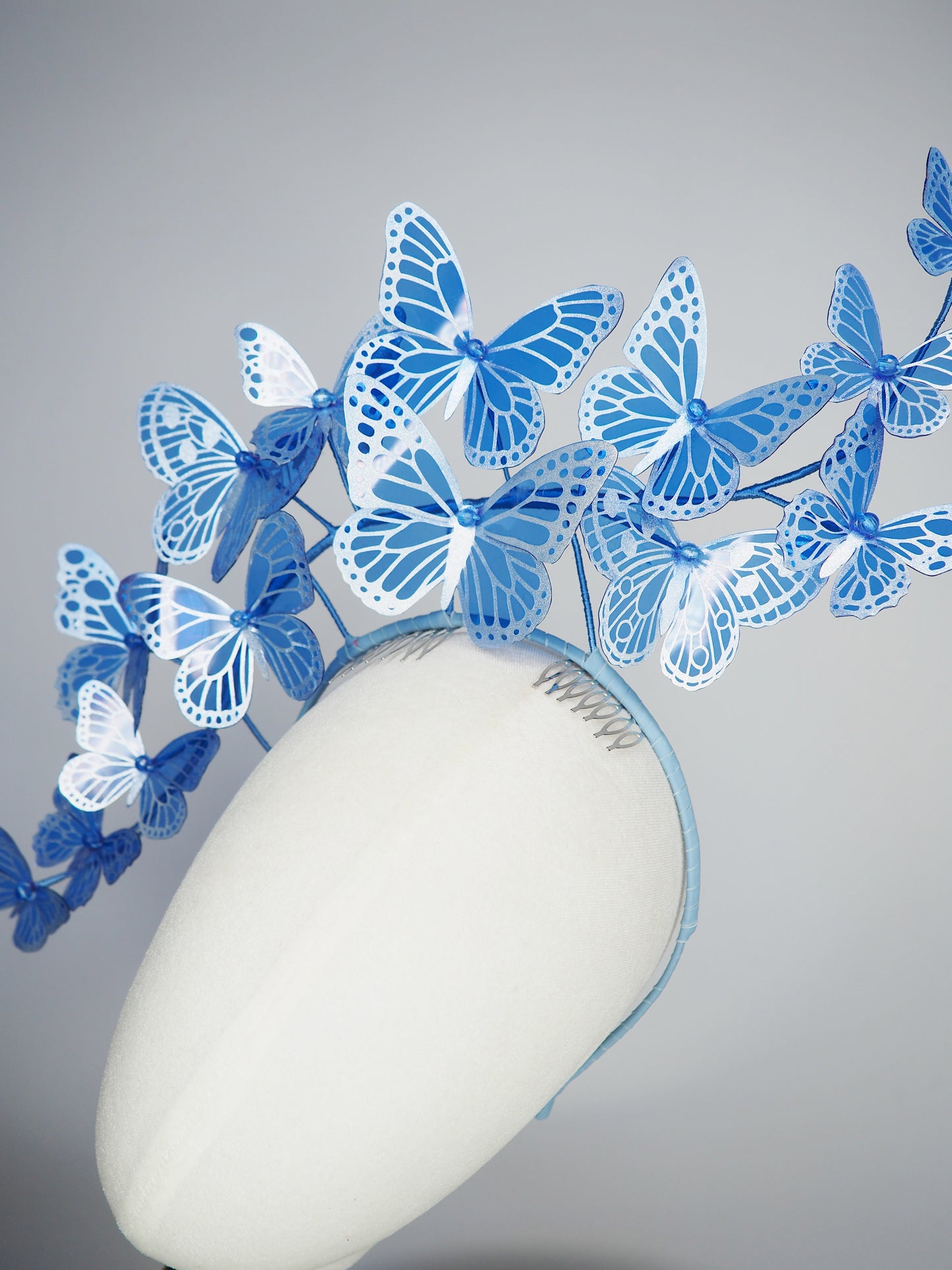 Dancing Wings - A graceful cascade of blue butterflies that appear to float effortlessly around the face.