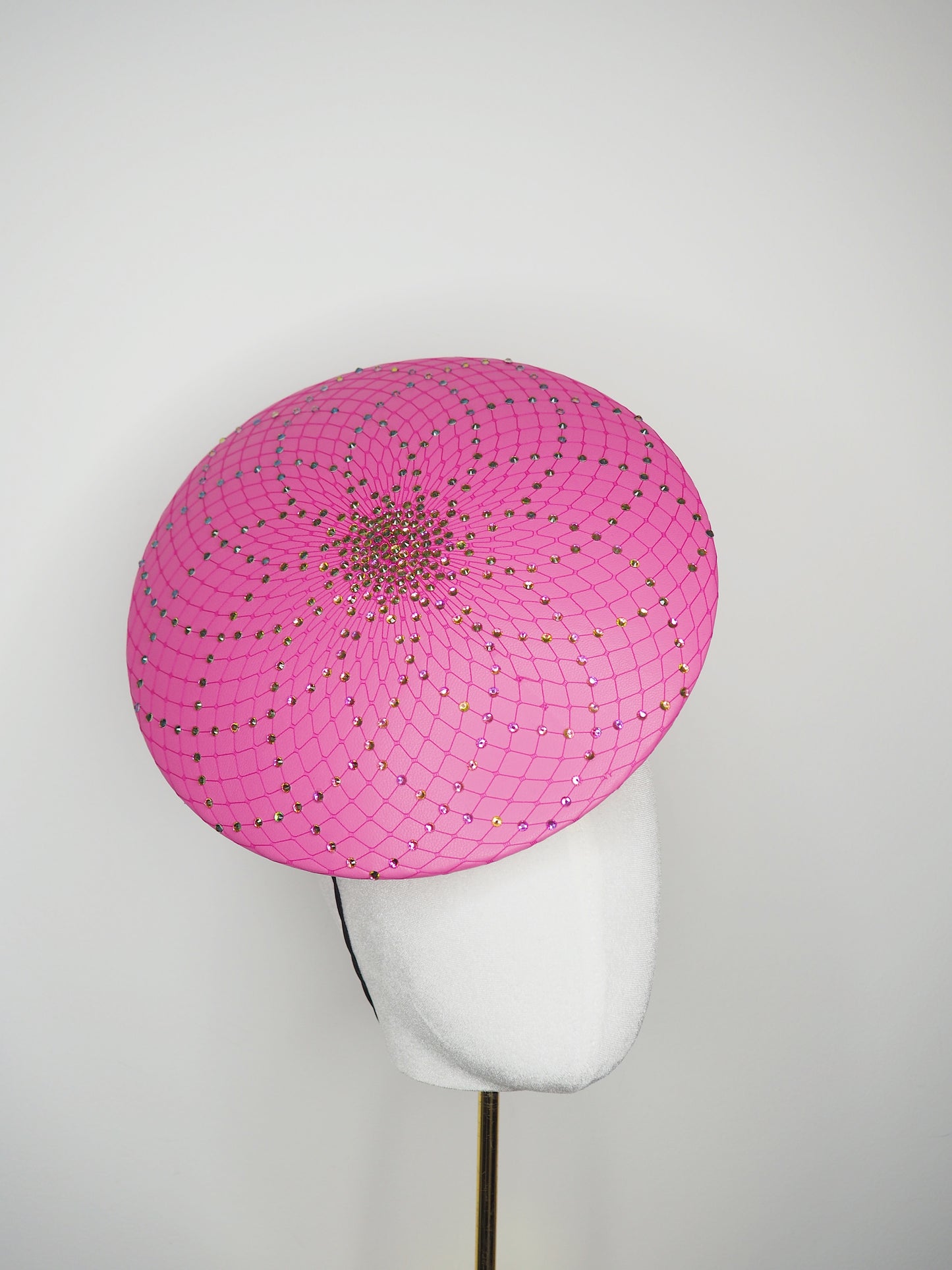 A Little Bit Wicked - Candy pink  crystal encrusted leather disc with flower and wired swirl trim.