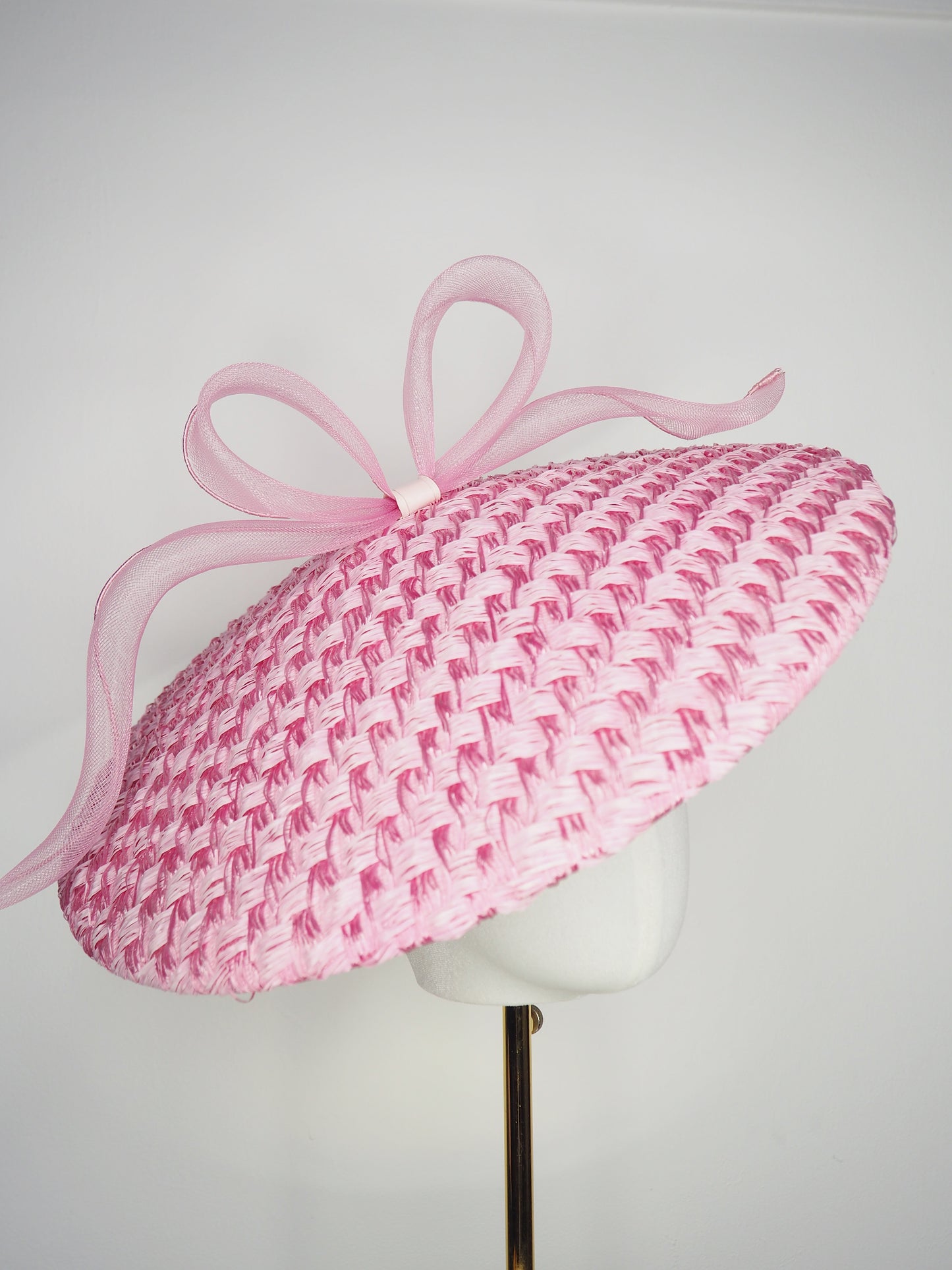 Pink Ribbon -Candy pink coolie brim crowned with a sculptural floating crinoline bow.