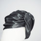 Glass Lake - A sculptural blocked turban crafted from luminous fabric inspired by morning reflections on water.