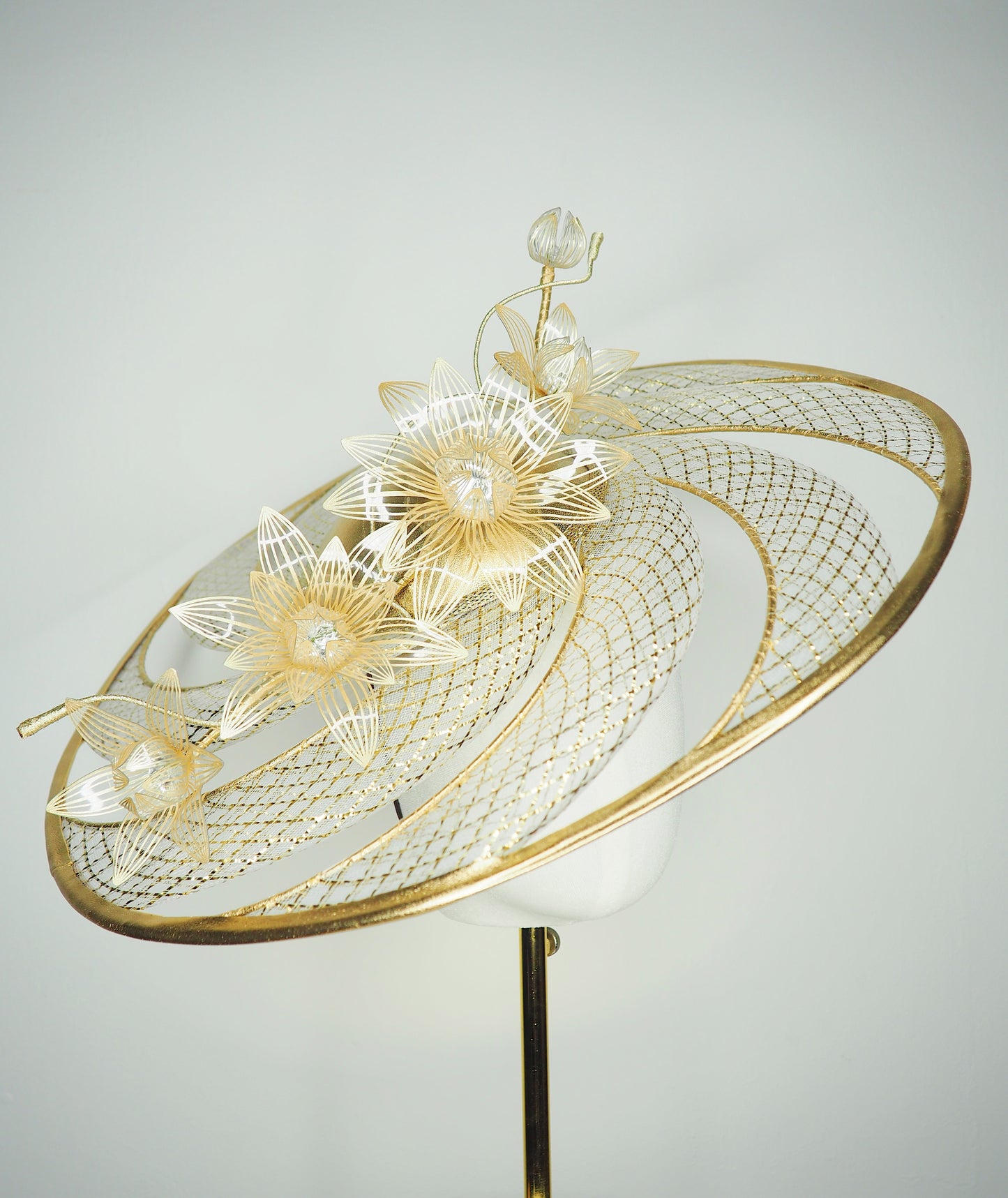 Ray of light - Wired crinoline brim with metallic swirl and pale gold crystoform Lillies.
