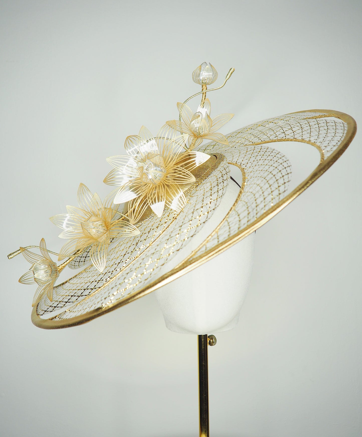 Ray of light - Wired crinoline brim with metallic swirl and pale gold crystoform Lillies.