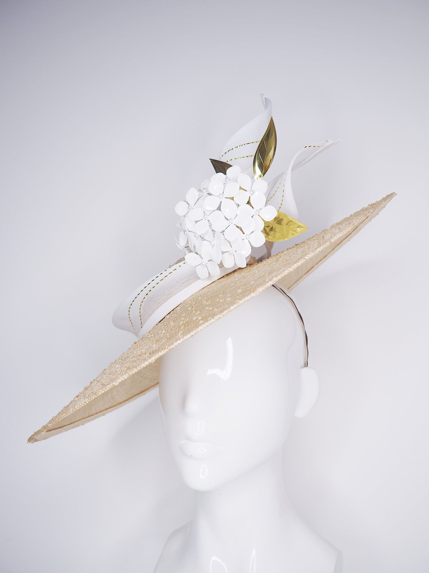 Natural Elegance - Natural knotted straw sloped brim with white hydrangea and gold lurex crinoline straw swirl