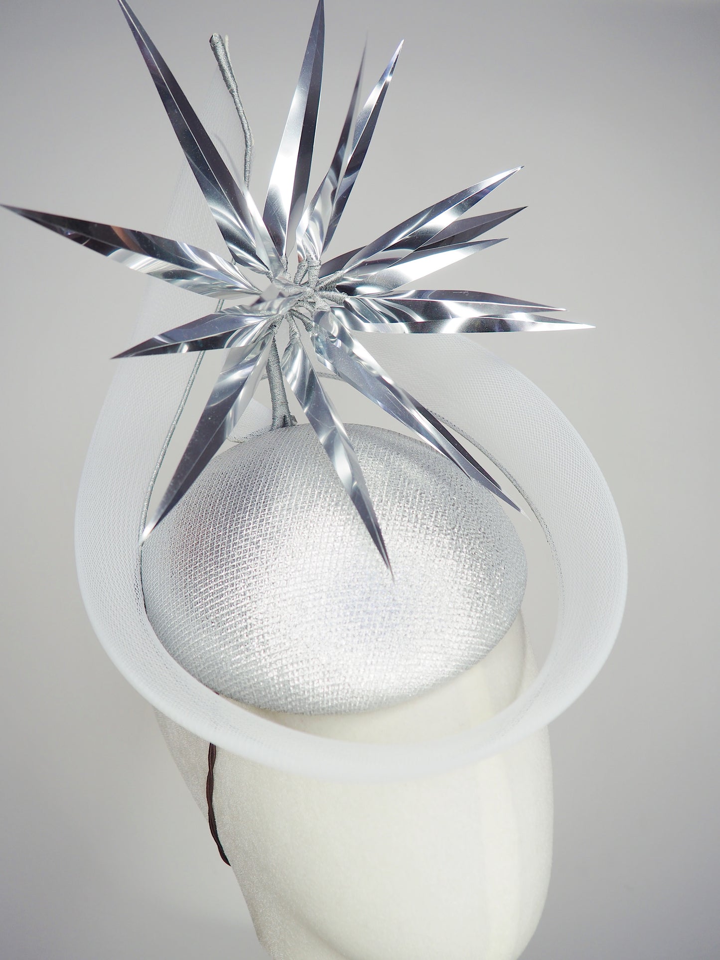 Silver Rays - Silver crinoline swirl and lurex base with floating silver starburst