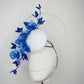 Dancing Orchids - Blue crystoform orchids on a white leather veiles percher base with veil detail