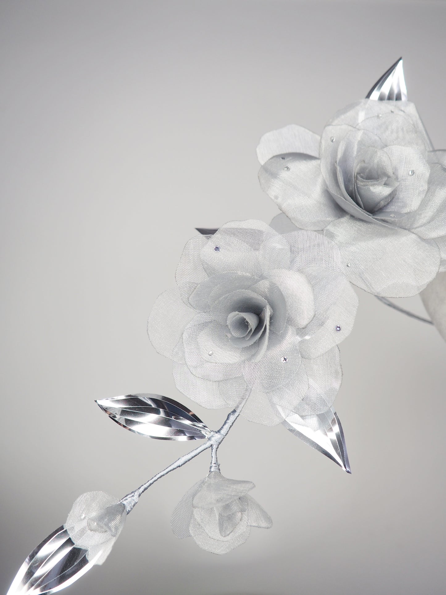 Dewdrops on Roses - Couture wraparound headpiece of sculptural silver roses sparkling with crystal dewdrops.
