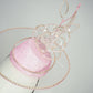 Belle Époque - pastel pink pillbox featuring a floating crystal rose surrounded by sculptural crystoform metallic swirls.