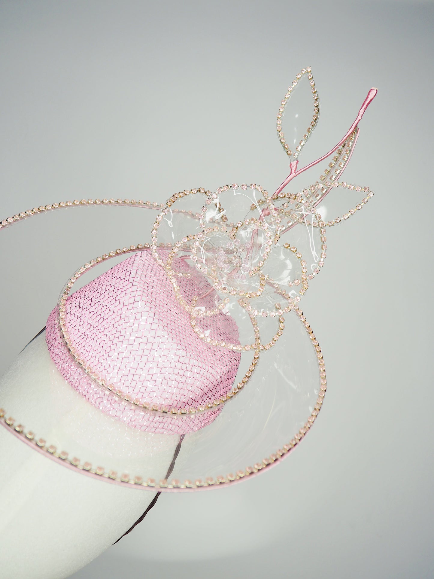 Belle Époque - pastel pink pillbox featuring a floating crystal rose surrounded by sculptural crystoform metallic swirls.