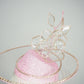 Belle Époque - pastel pink pillbox featuring a floating crystal rose surrounded by sculptural crystoform metallic swirls.