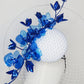 Dancing Orchids - Blue crystoform orchids on a white leather veiles percher base with veil detail