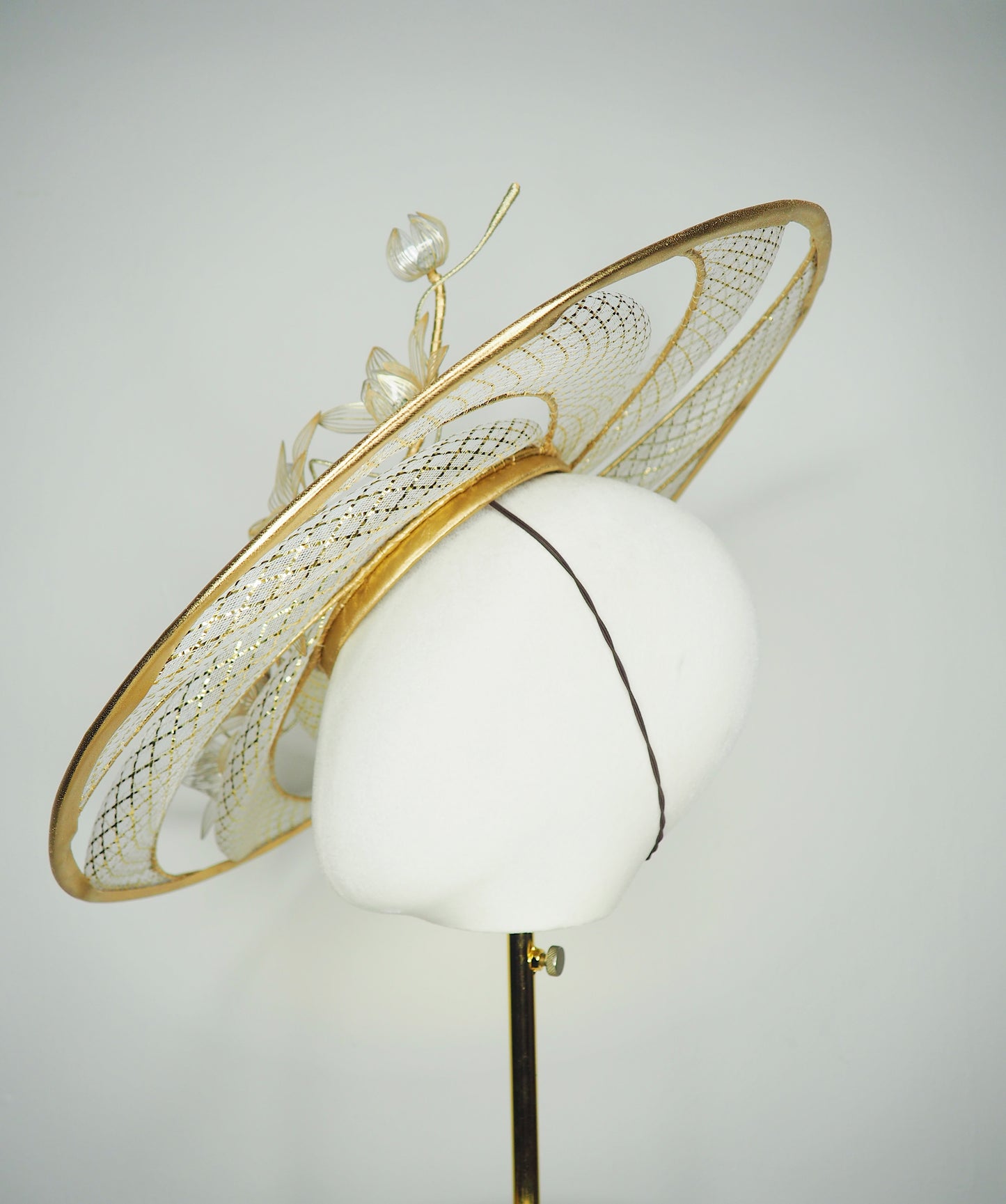 Ray of light - Wired crinoline brim with metallic swirl and pale gold crystoform Lillies.
