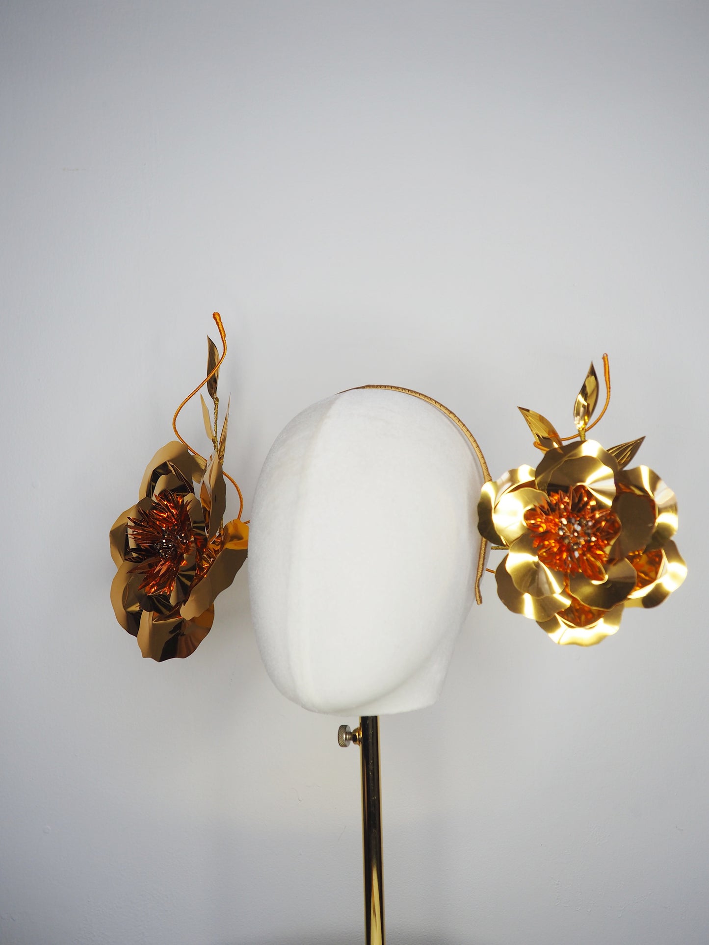 Sunlit Bloom - A wraparound floral headpiece featuring oversized golden blooms with vibrant orange centres.