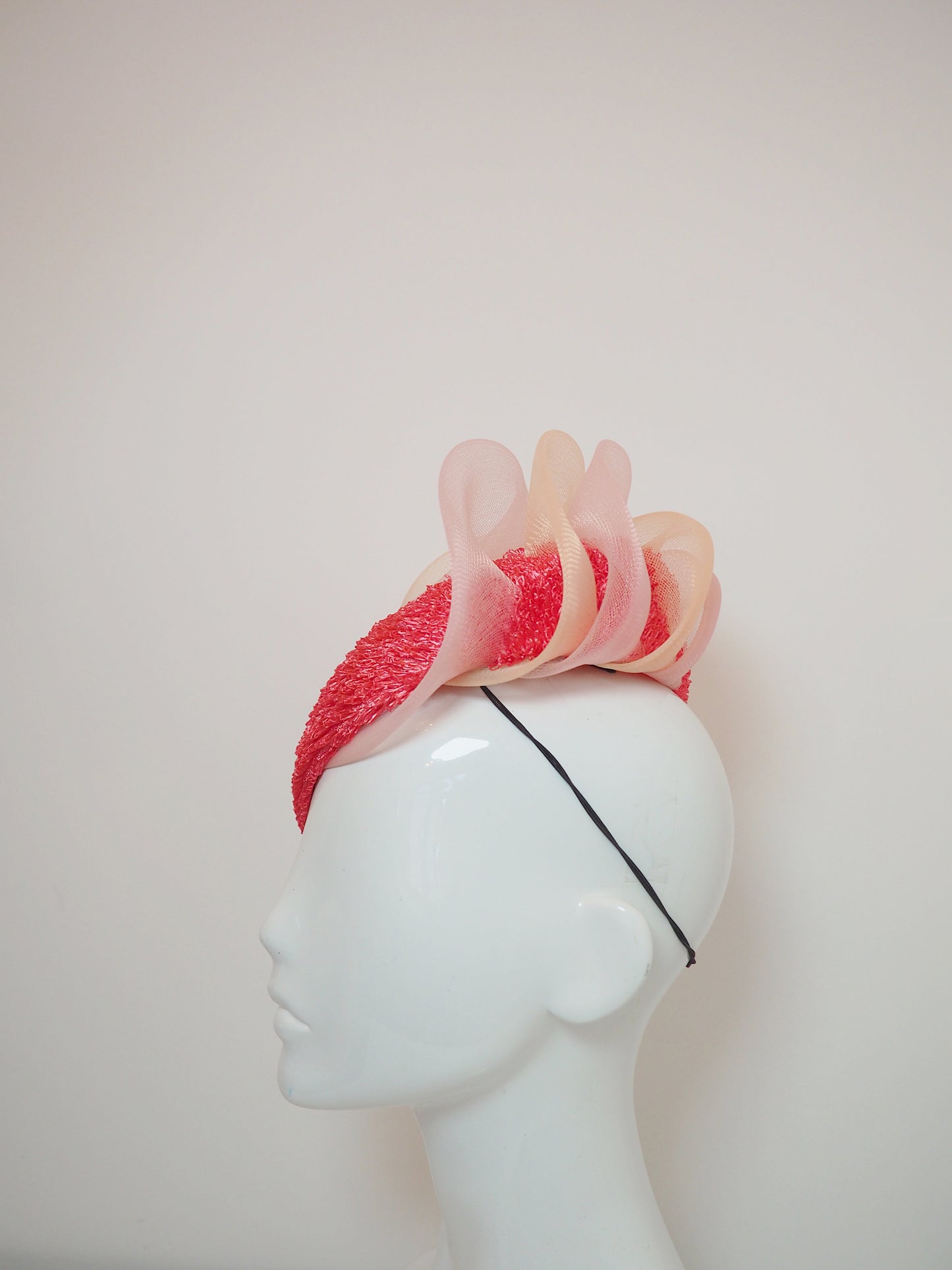 Pink Coral - Vintage raffia watermelon pink straw with pink and peach ruffle crinoline detail on a face hugger base.