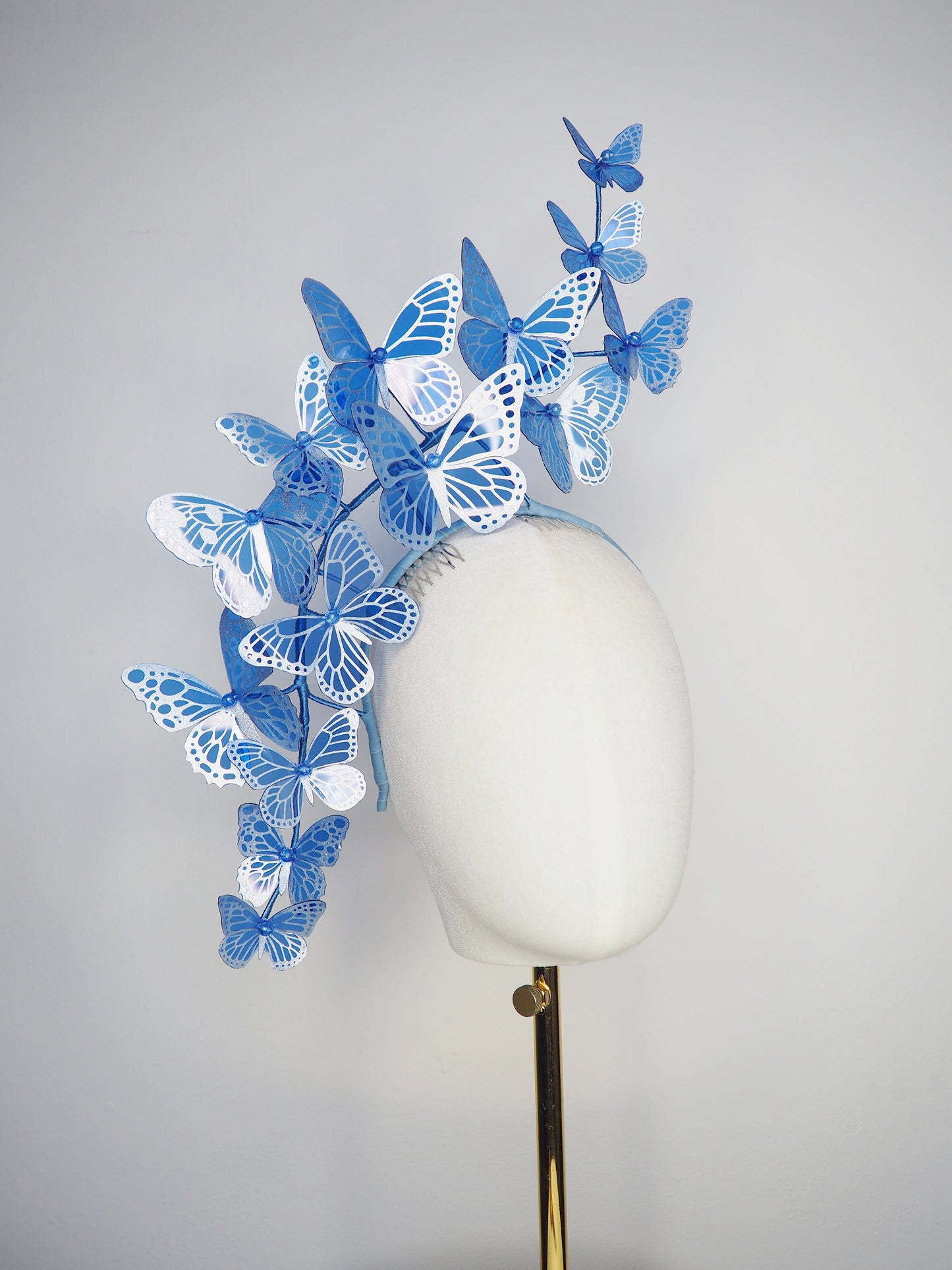 Dancing Wings - A graceful cascade of blue butterflies that appear to float effortlessly around the face.