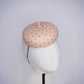 Morning Glow - A timeless nude button fascinator finished with blush crystals and elegant veiling.