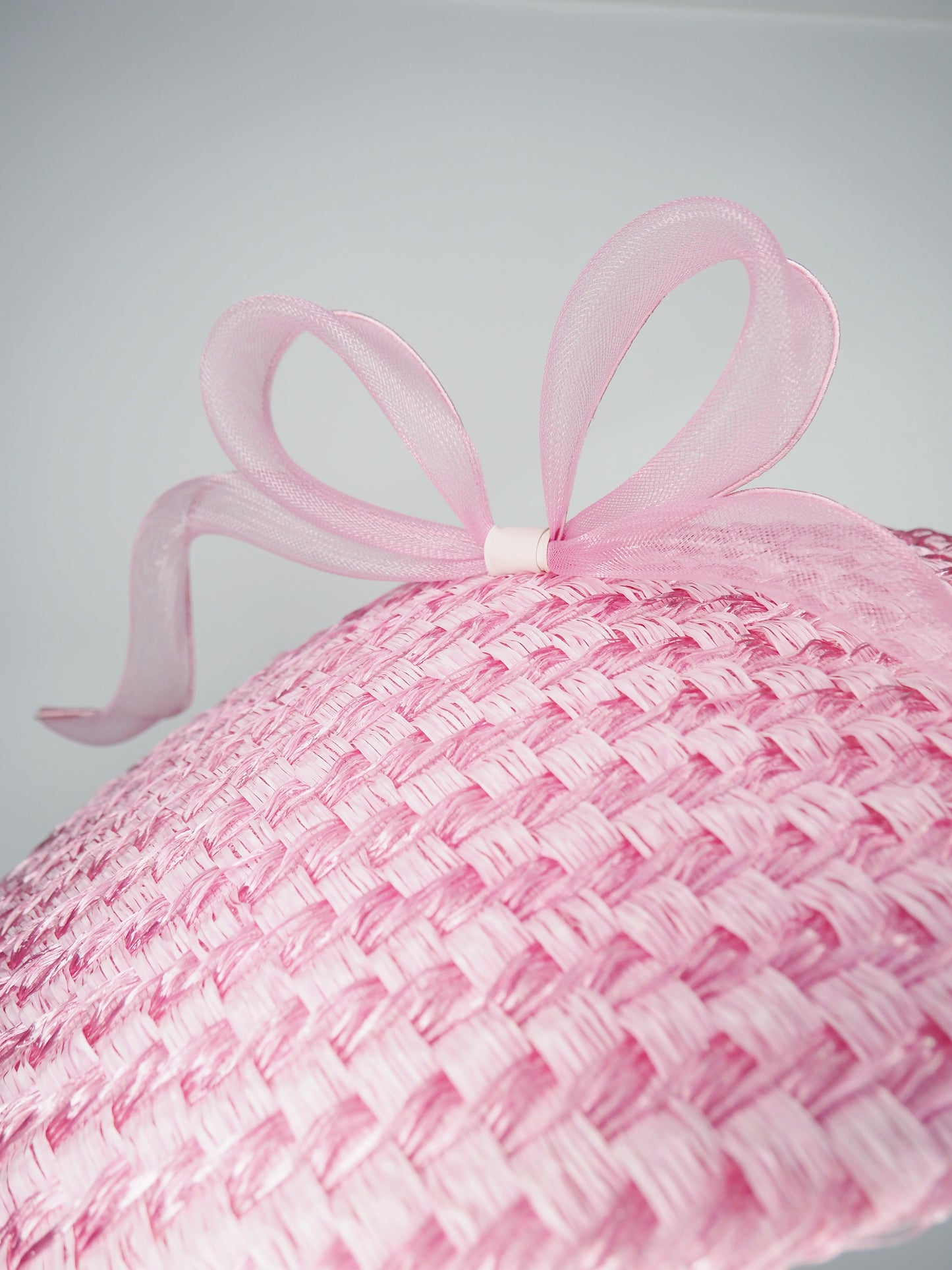Pink Ribbon -Candy pink coolie brim crowned with a sculptural floating crinoline bow.