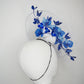 Dancing Orchids - Blue crystoform orchids on a white leather veiles percher base with veil detail