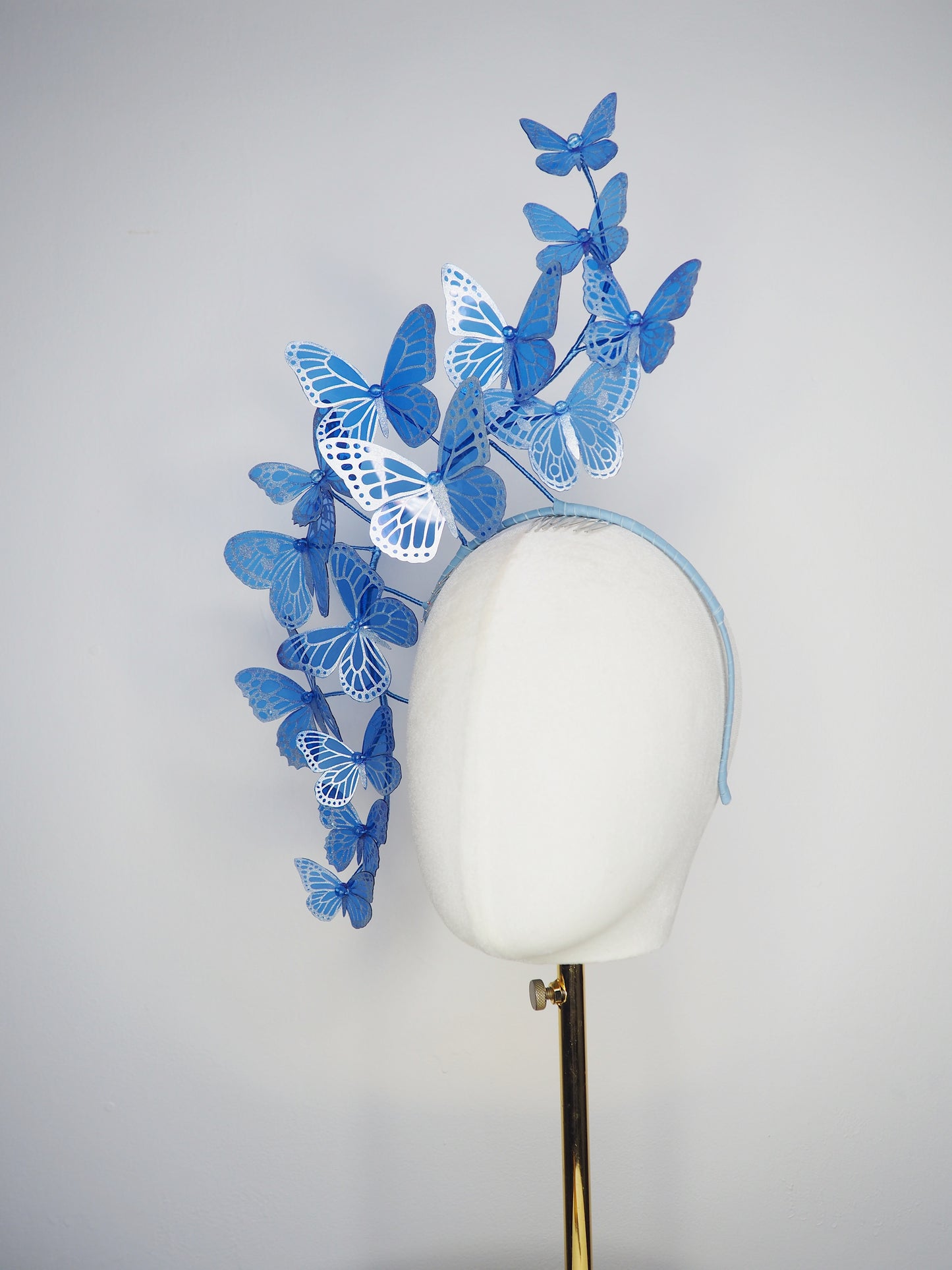Dancing Wings - A graceful cascade of blue butterflies that appear to float effortlessly around the face.