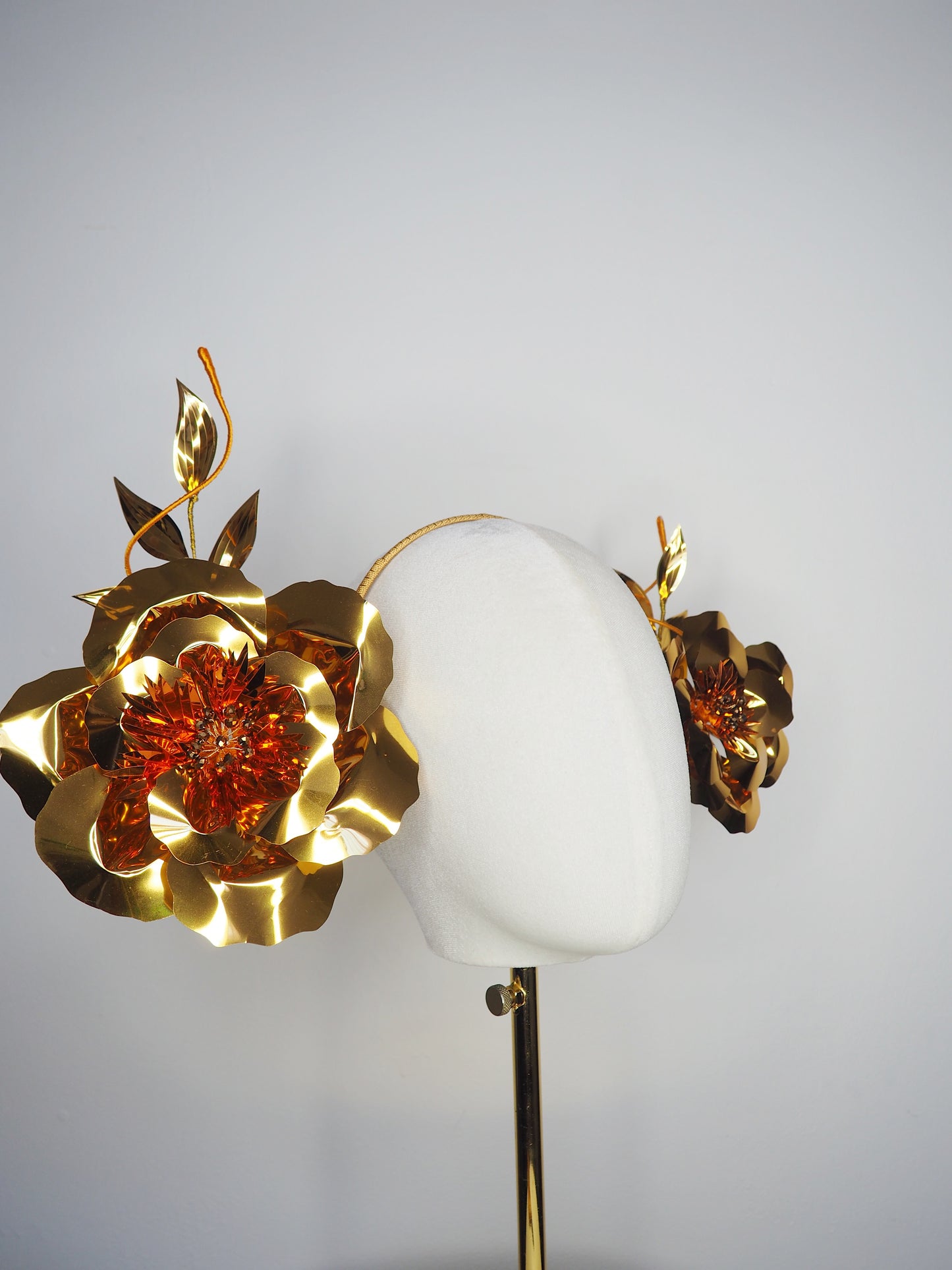 Sunlit Bloom - A wraparound floral headpiece featuring oversized golden blooms with vibrant orange centres.