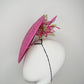 A Little Bit Wicked - Candy pink  crystal encrusted leather disc with flower and wired swirl trim.