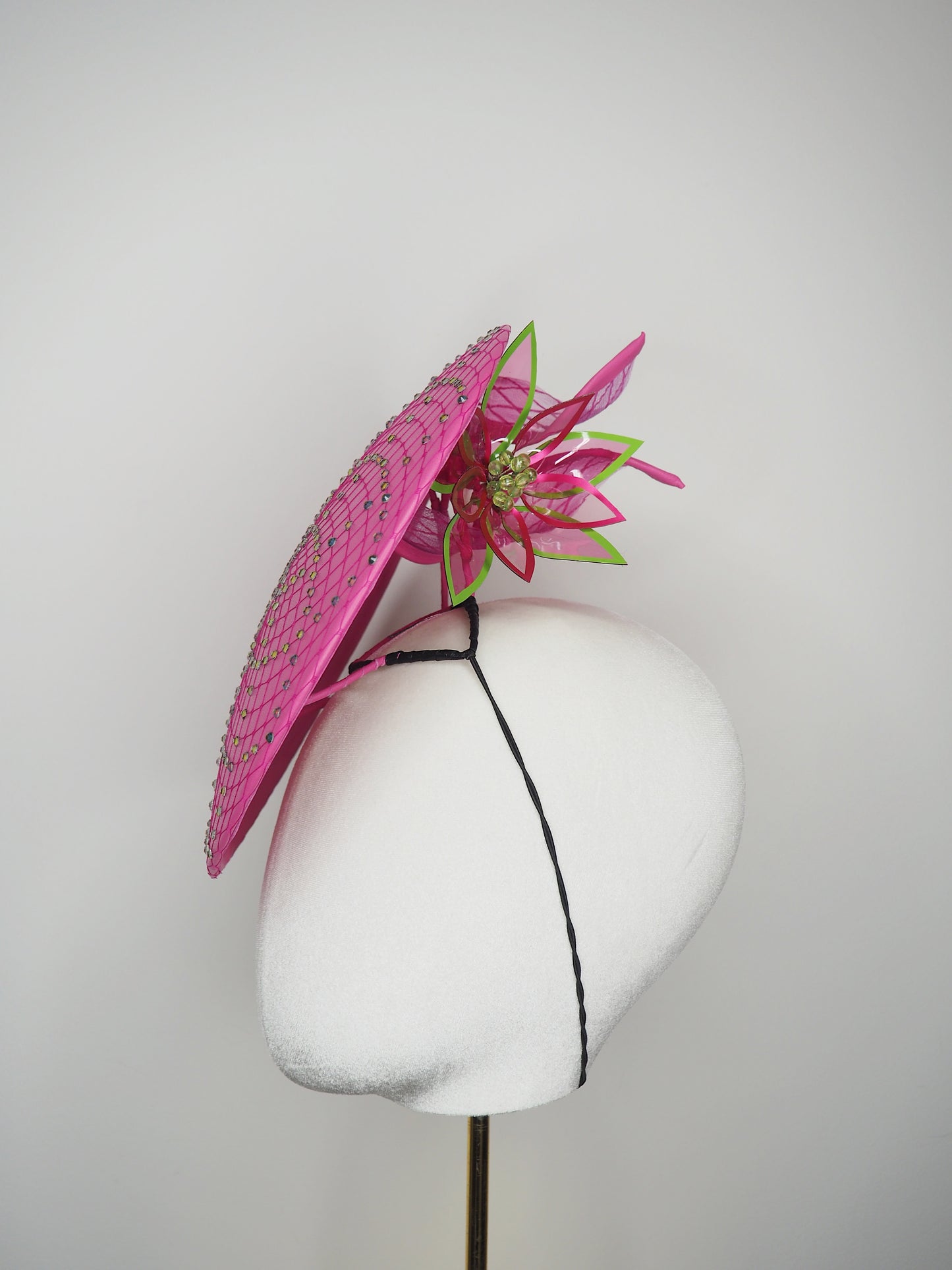 A Little Bit Wicked - Candy pink  crystal encrusted leather disc with flower and wired swirl trim.