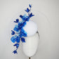 Dancing Orchids - Blue crystoform orchids on a white leather veiles percher base with veil detail