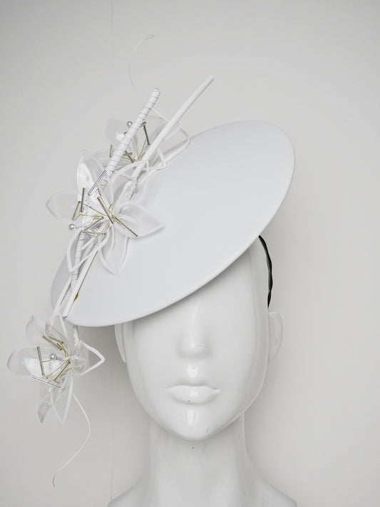 Lys En Blanc - White Crystoform Lillies on a floating leather disk with quill detail.