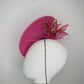 A Little Bit Wicked - Candy pink  crystal encrusted leather disc with flower and wired swirl trim.