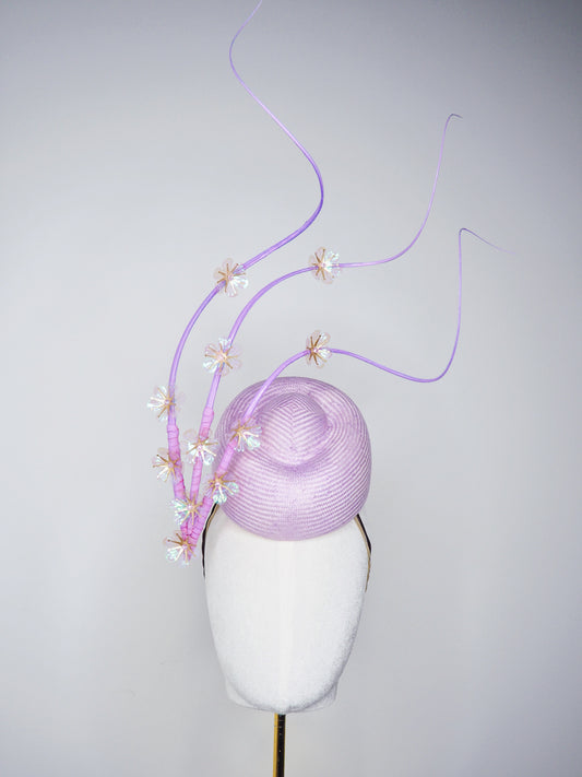 Blossoms in Flight - 	Pastel lilac pork pie pillbox with floating quills and iridescent cherry blossom detail