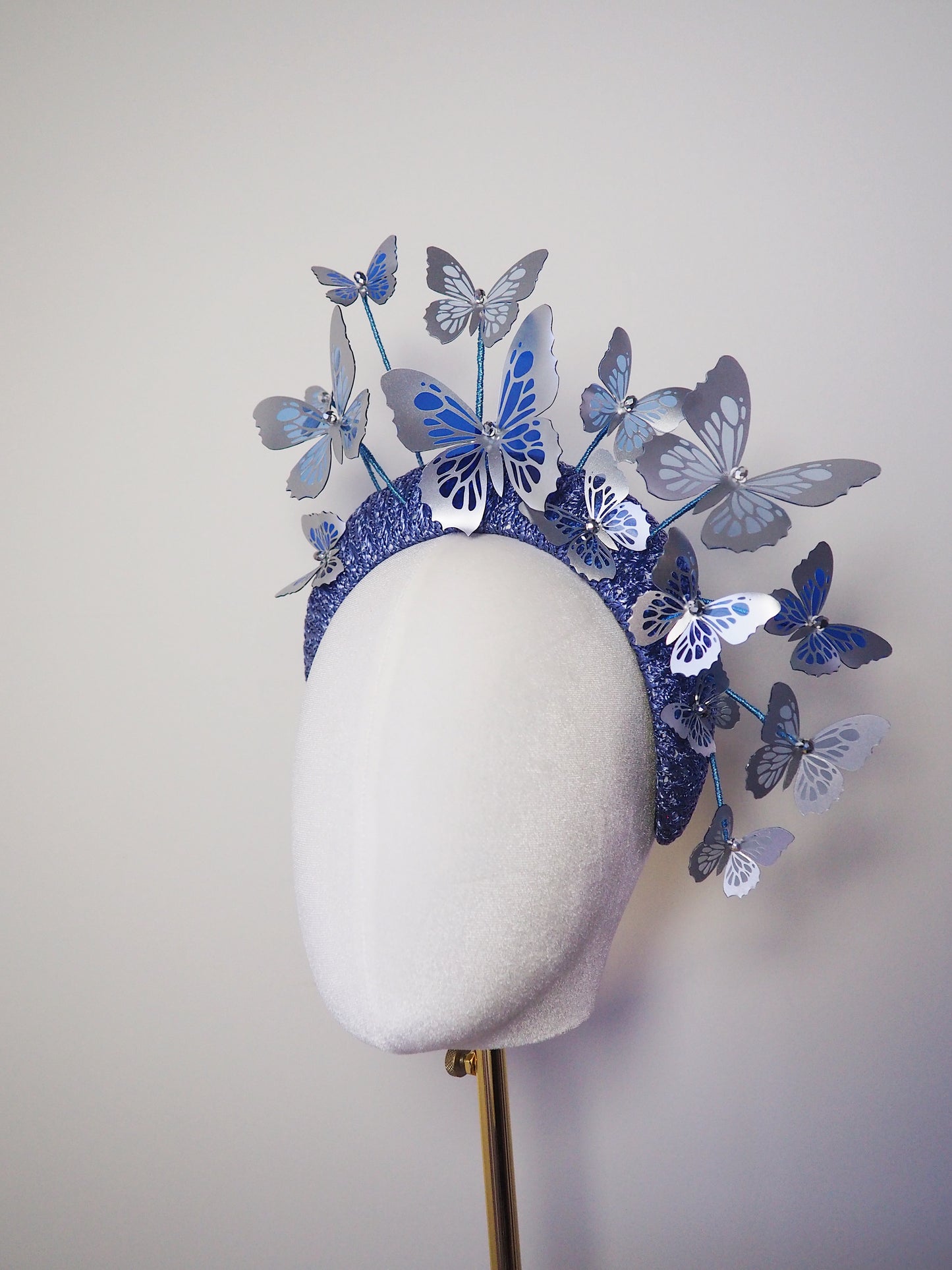Flutter and fly - Crystoform butterflies in shades of blue with silver detail on a 3d vintage straw headband.