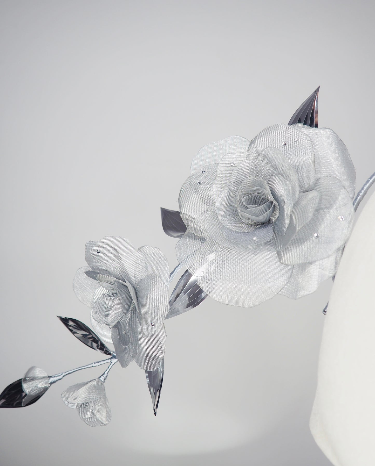 Dewdrops on Roses - Couture wraparound headpiece of sculptural silver roses sparkling with crystal dewdrops.