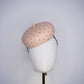 Morning Glow - A timeless nude button fascinator finished with blush crystals and elegant veiling.