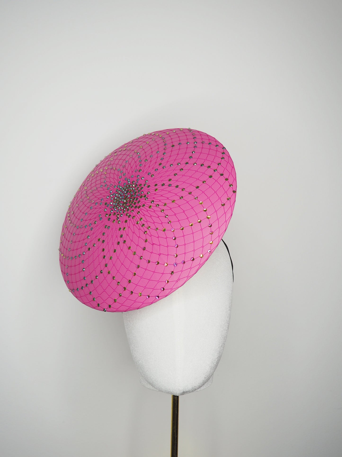 A Little Bit Wicked - Candy pink  crystal encrusted leather disc with flower and wired swirl trim.