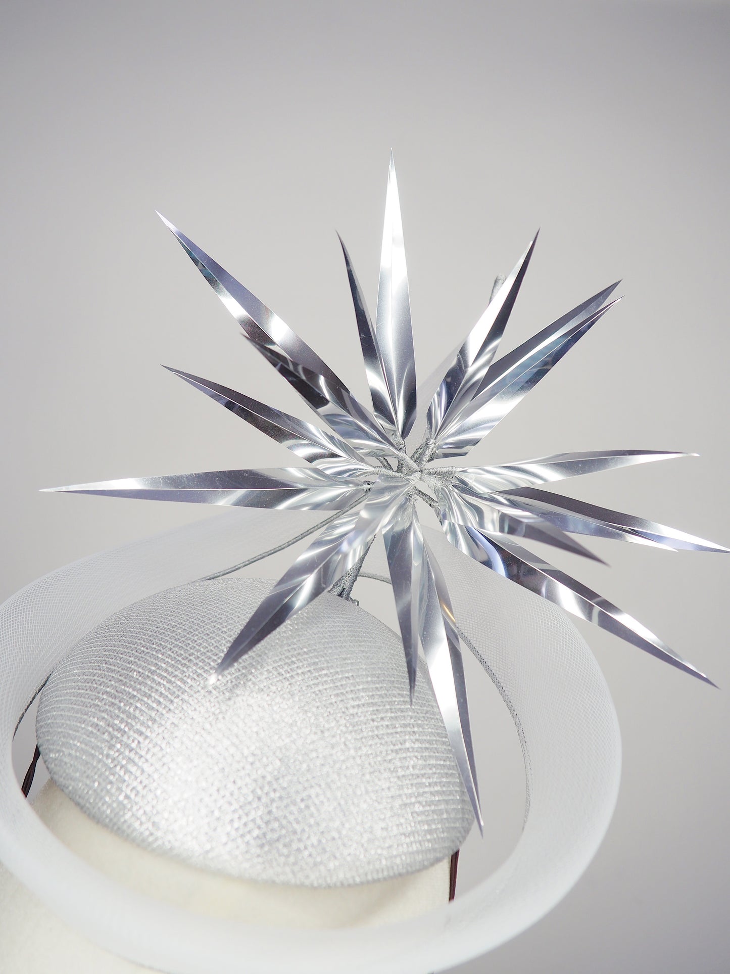 Silver Rays - Silver crinoline swirl and lurex base with floating silver starburst