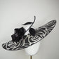 De Ville Rose - Sweeping crystoform wired brim with black rose petal pattern and single shiny dramatic rose with white leather veiled crown